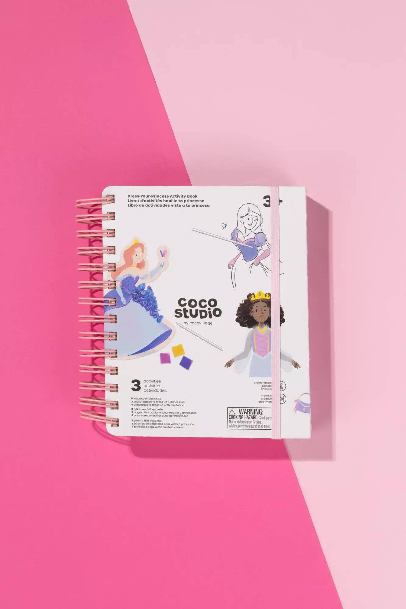 Coco Studio doll packaging on a pink background