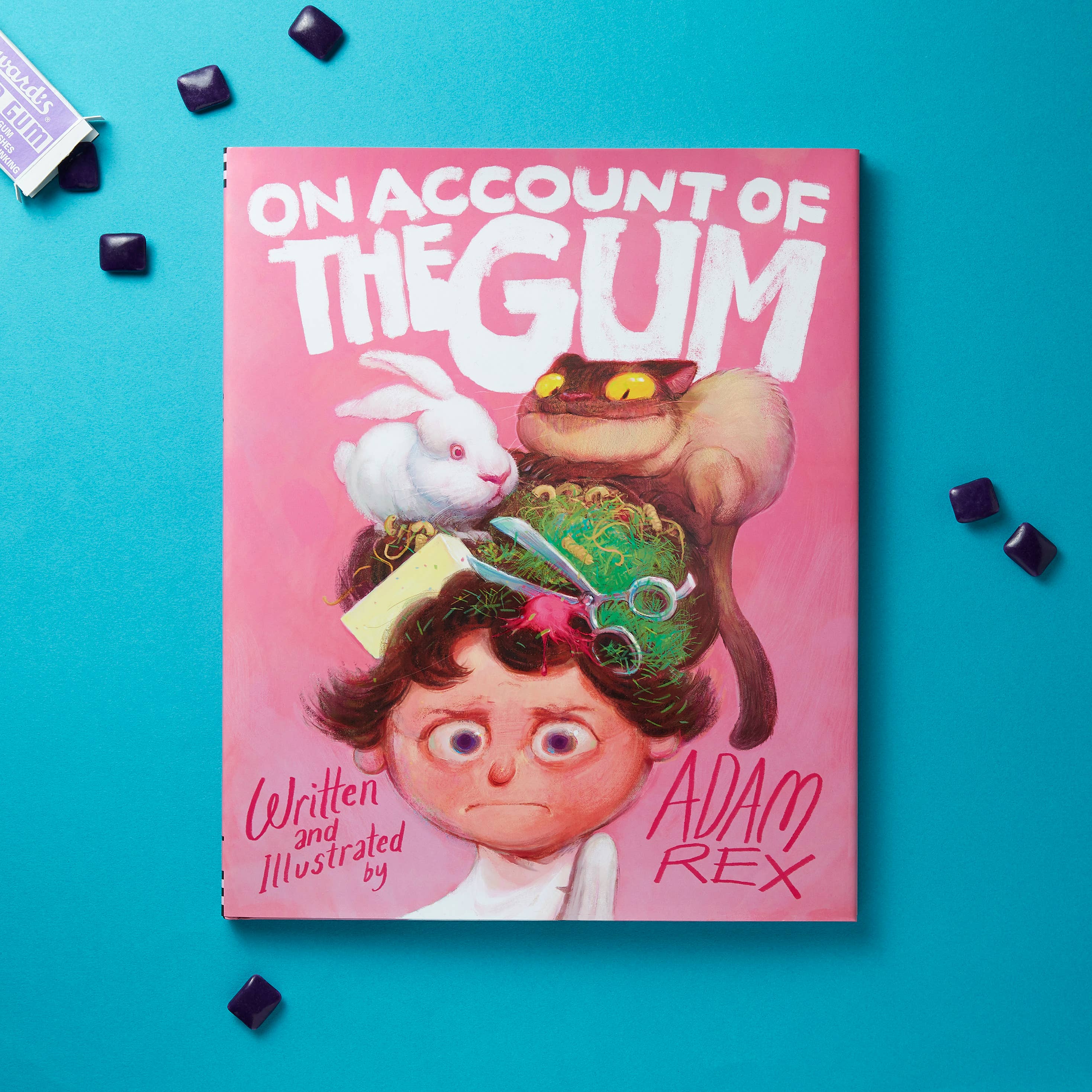 Book cover of 'On Account of the Gum' by Adam Rex on a blue background with gum pieces.