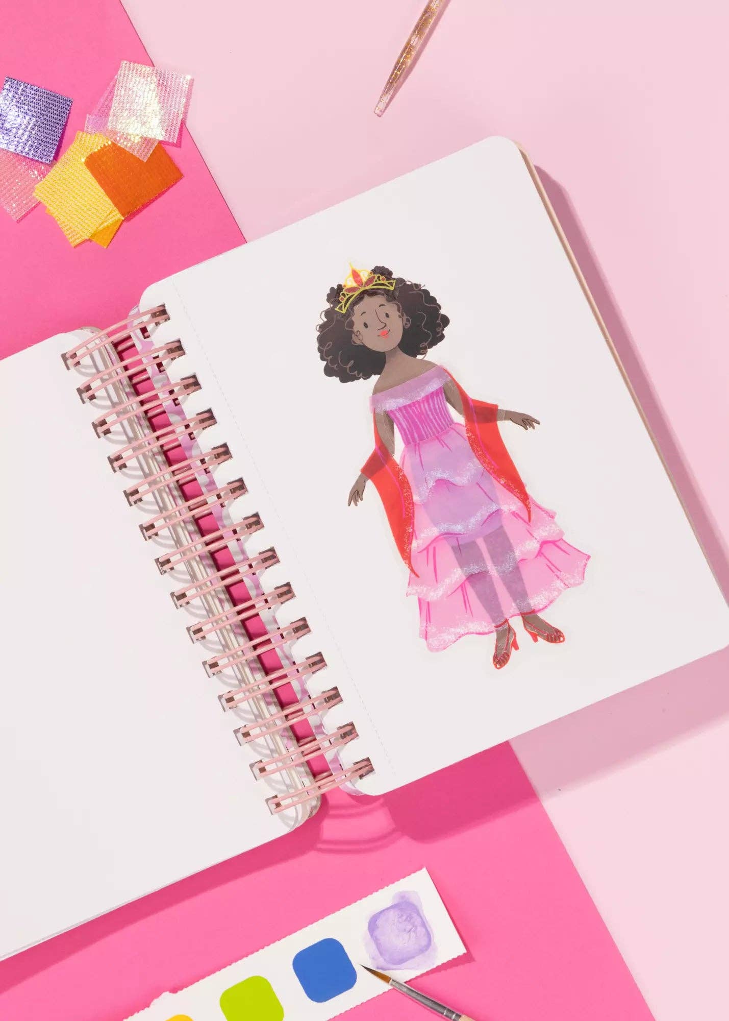 Notebook with a colorful illustration of a princess on a pink background