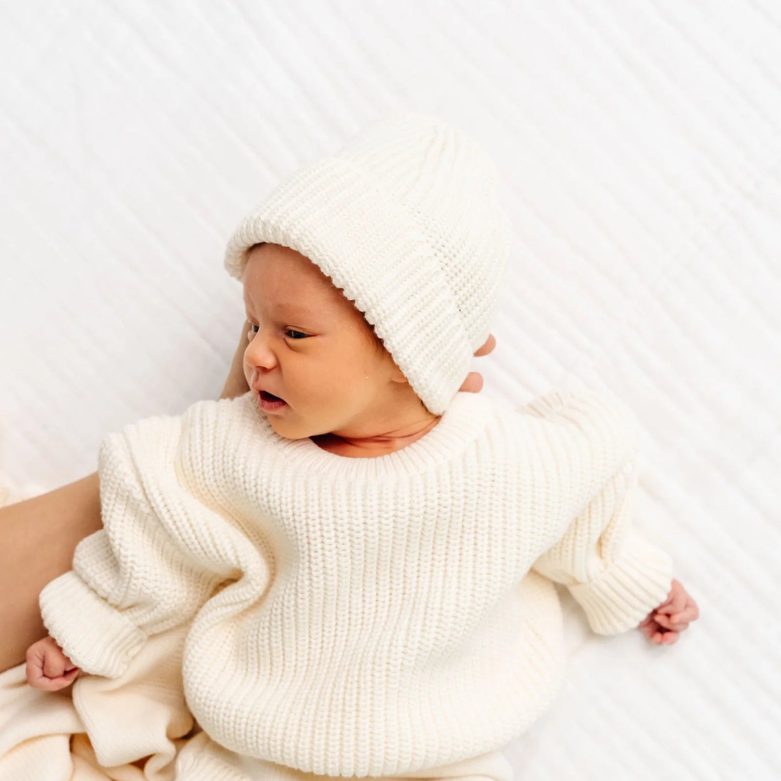 Sweater Knit Hat on a Baby in Ivory