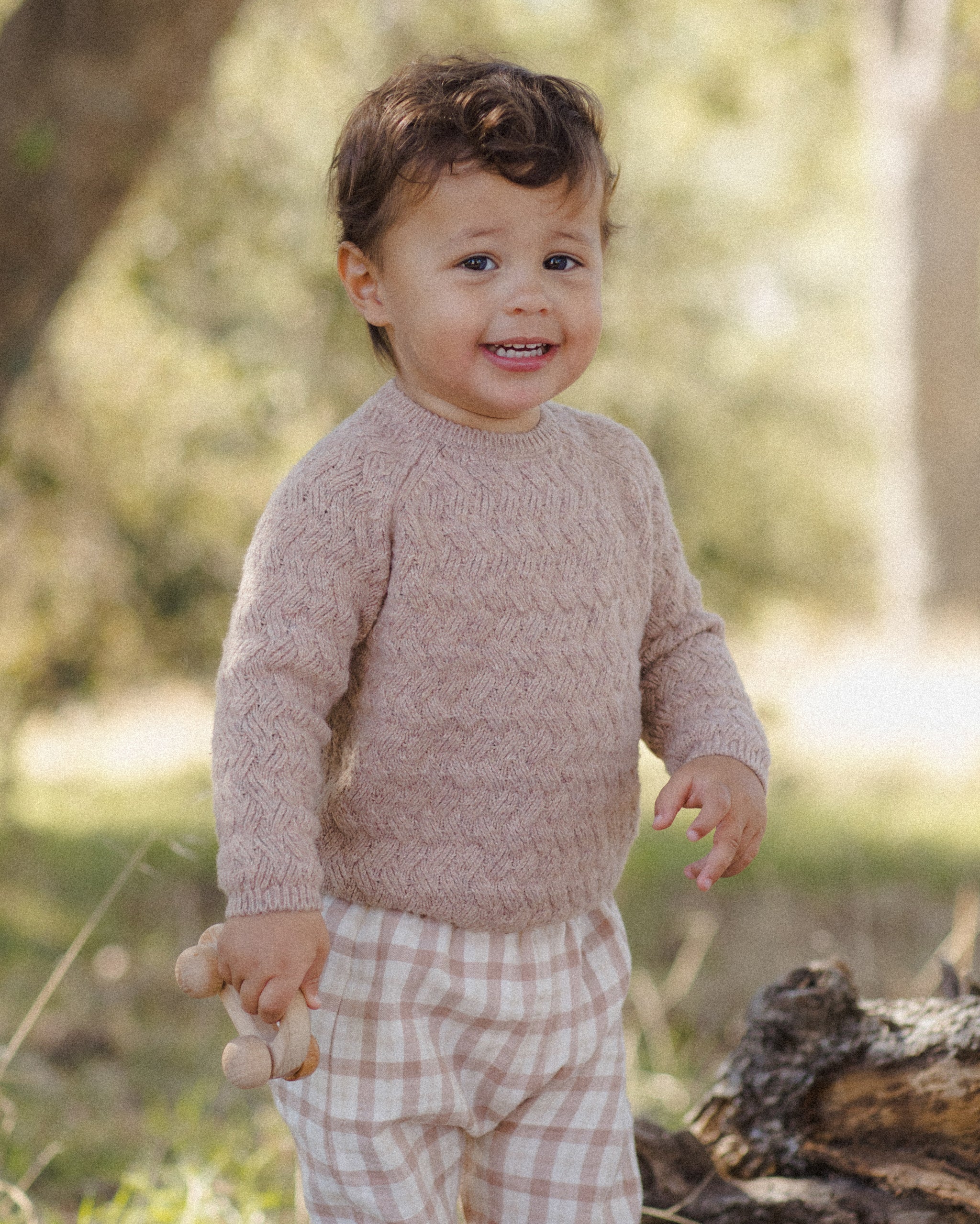 Boy wearing heathered almond ribbed knit sweater, perfect for fall family photos and Thanksgiving outfits.