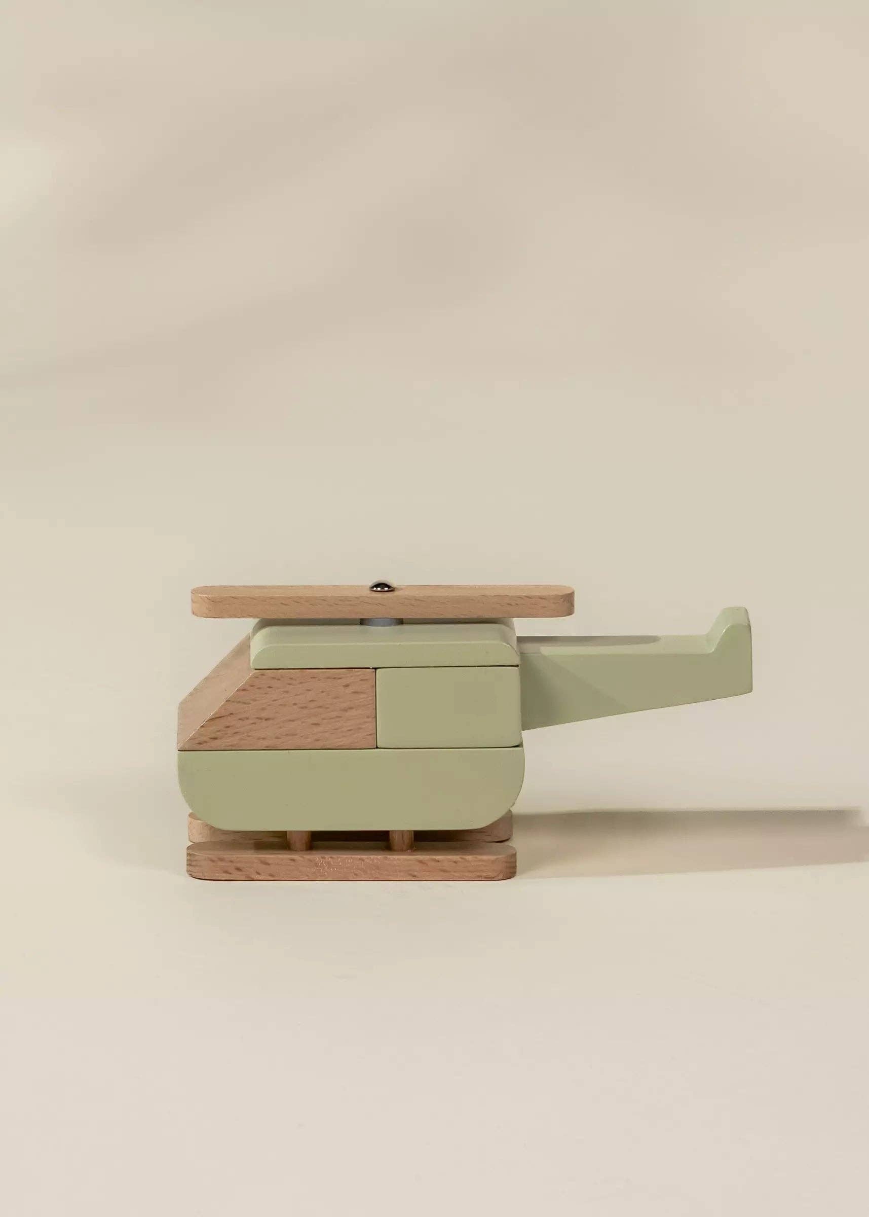 Wooden toy with a block design on a beige background