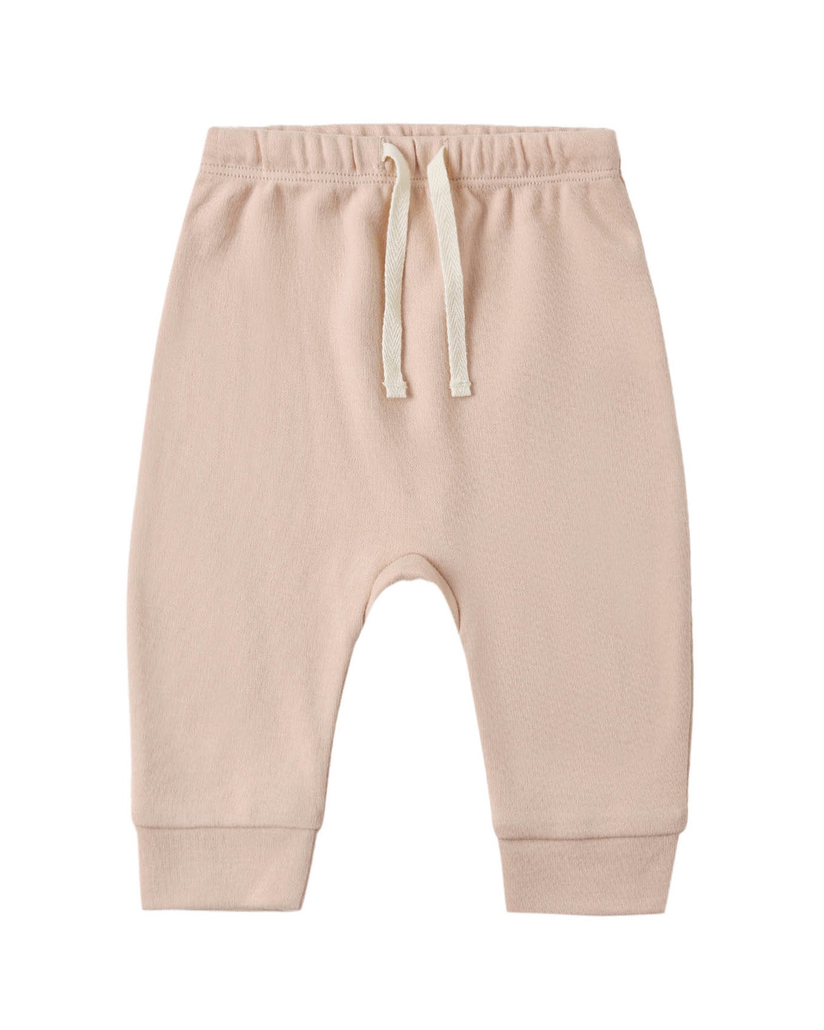 A pair of baby jogger pants in a soft, light peach-beige color, featuring an elastic waistband with a cream-colored drawstring and ribbed ankle cuffs, shown against a plain white background.