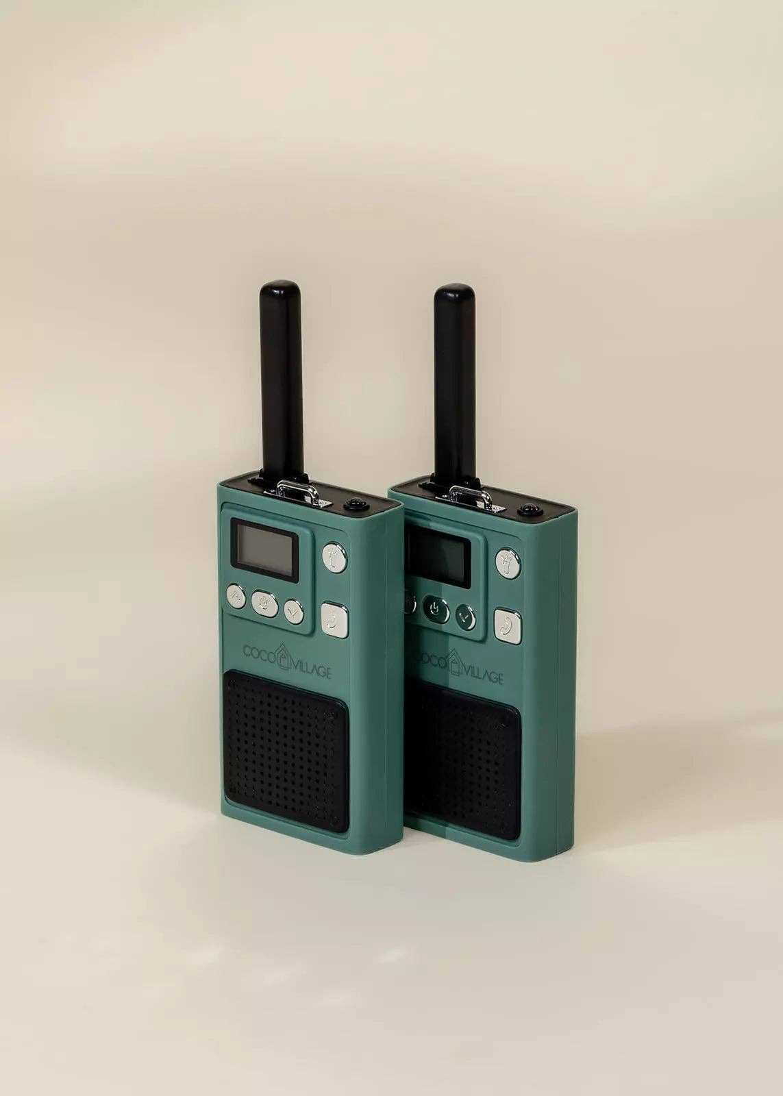 Two green walkie-talkies on a beige background