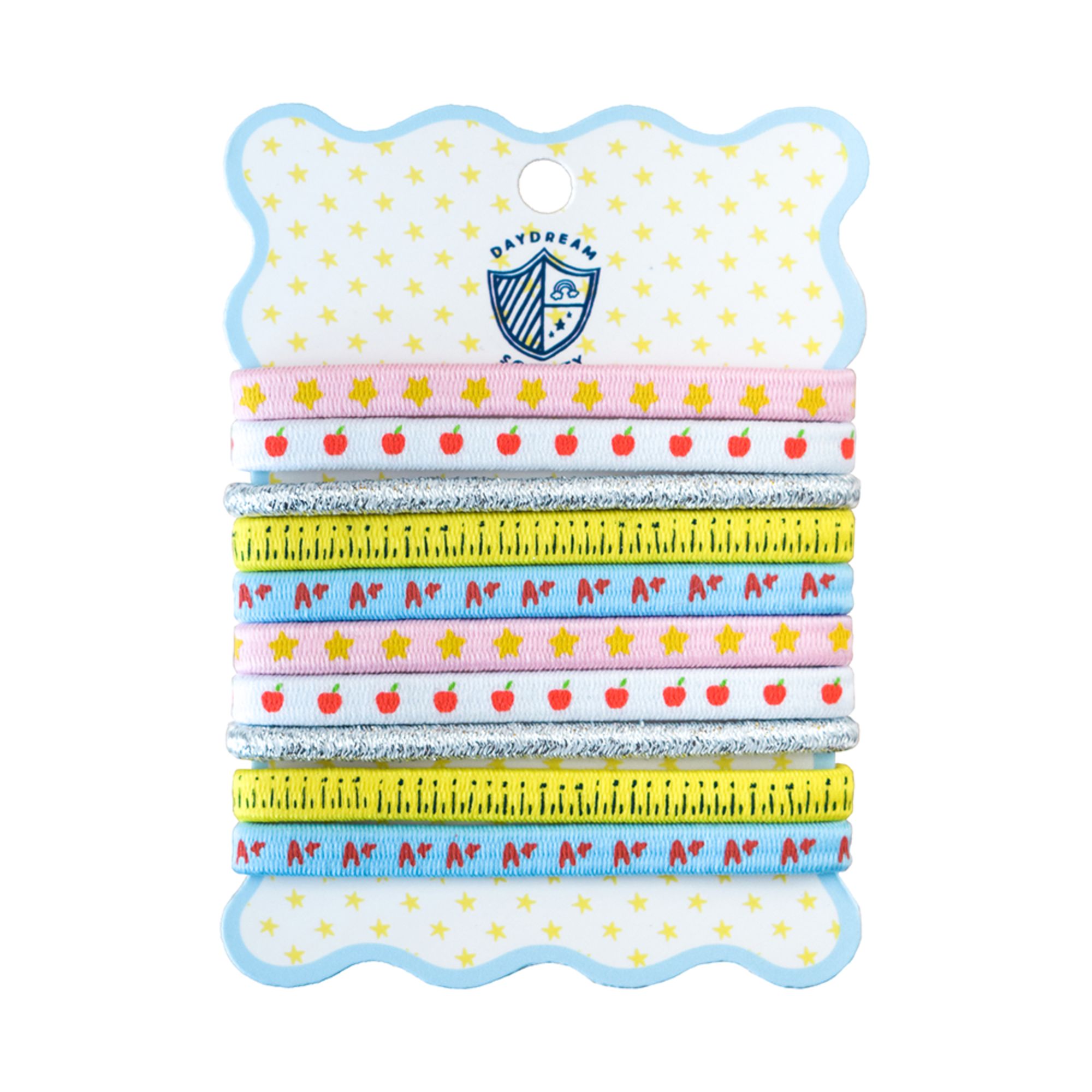 A set of six children's hair ties with school-themed patterns, packaged on a decorative white card with a blue scalloped border and a yellow star pattern. The hair ties feature designs of red apples, yellow stars, a yellow measuring tape, and red and blue letters on a light blue and white background.