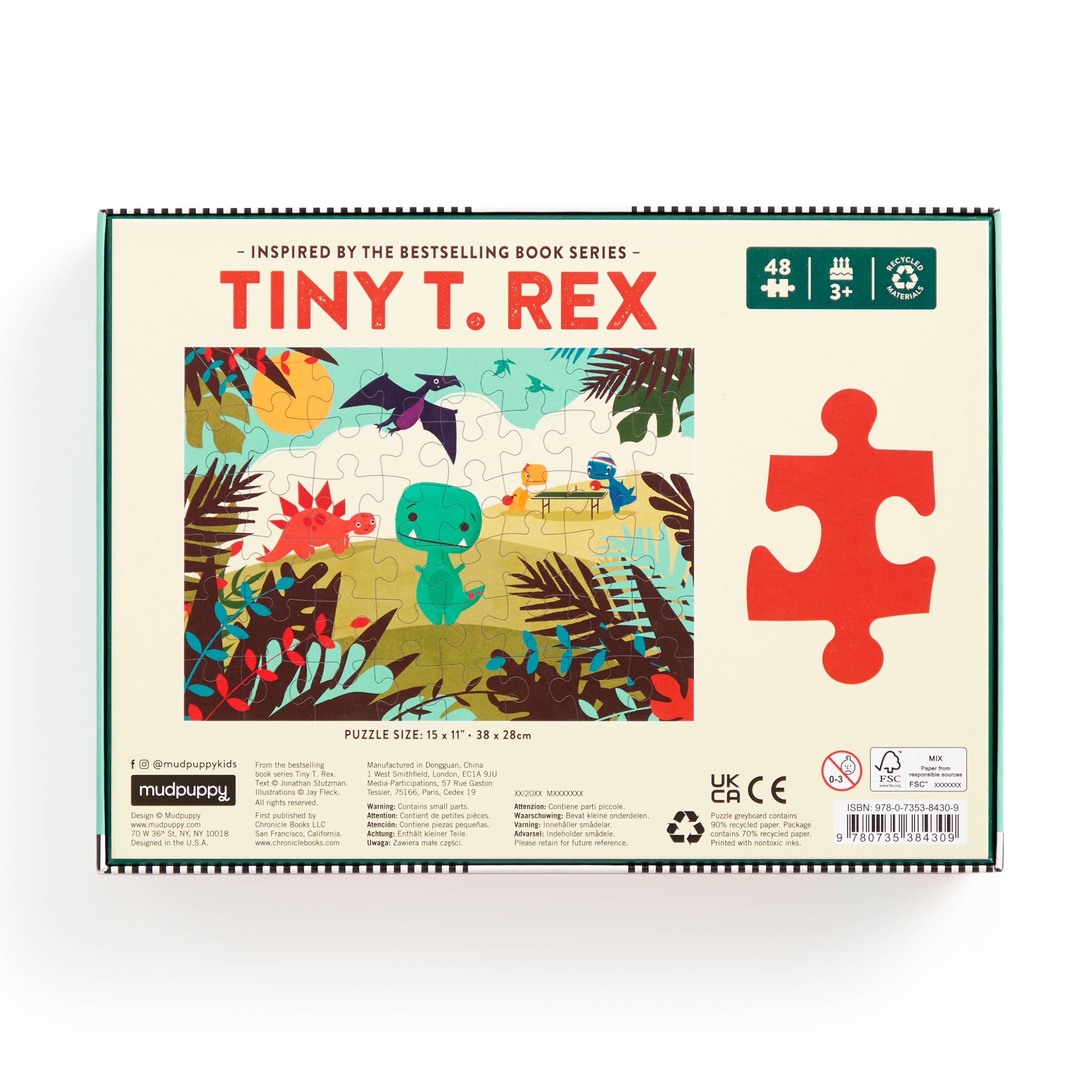 Jigsaw puzzle packaging for 'Tiny T. Rex' with colorful illustration and red puzzle piece.
