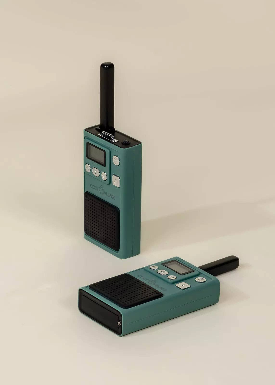 Two teal walkie-talkies on a beige background
