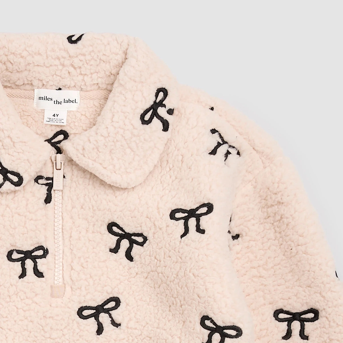 Bows Embroidered Sherpa Almond Half-Zip Pull-Over - miles the label Outerwear sold by Rosebud & Jo