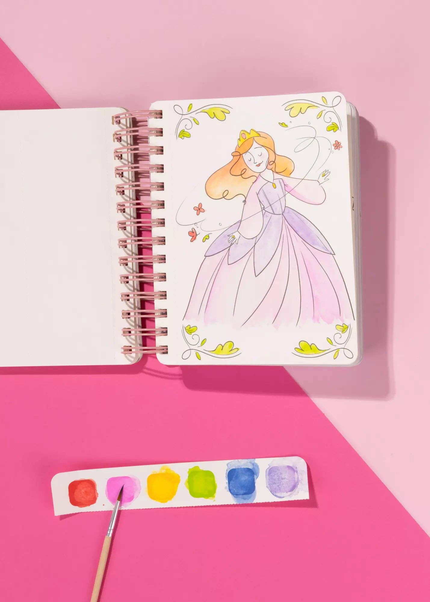 Notebook with princess illustration on a pink background