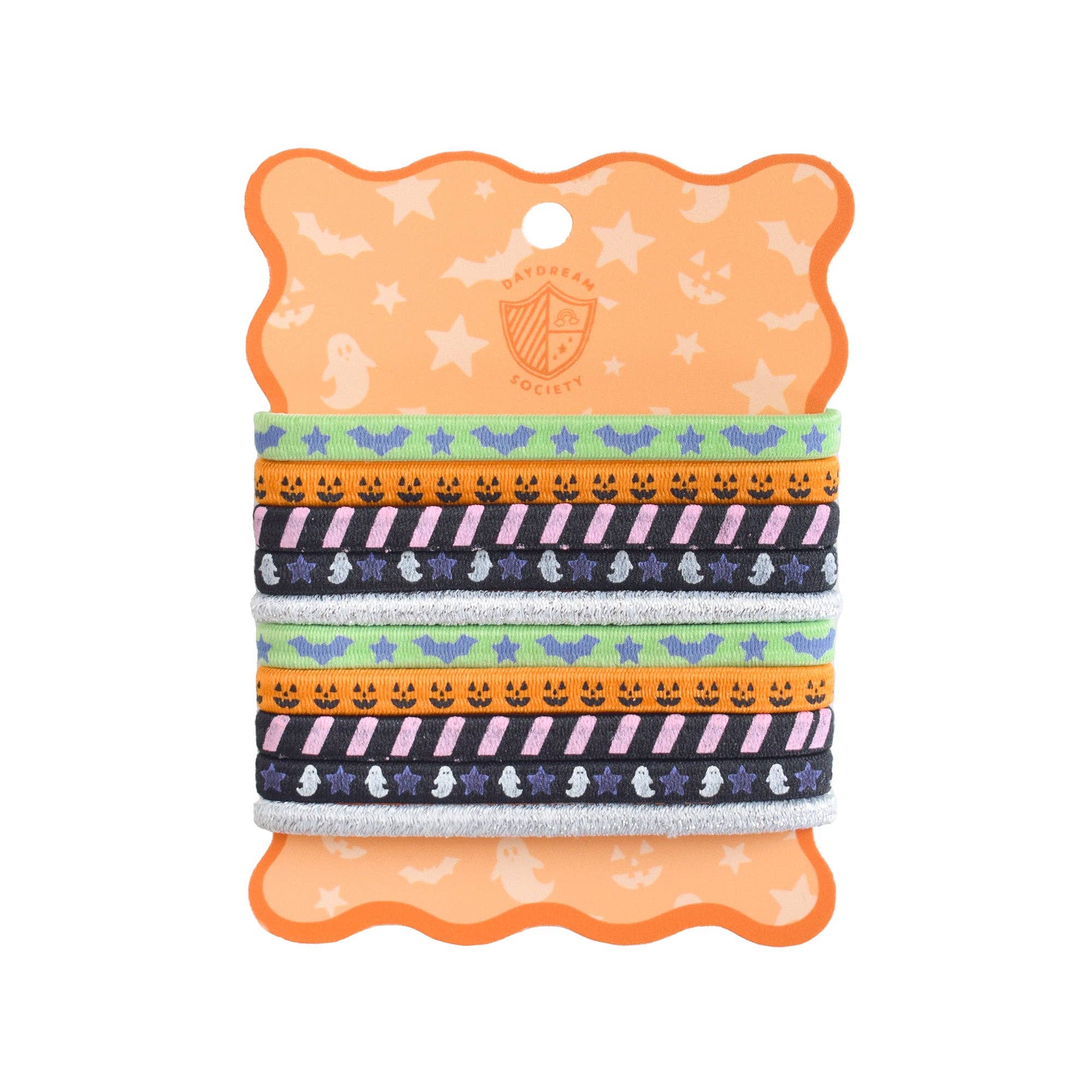A set of four Halloween-themed hair ties on an orange backing card. The hair ties feature various patterns including bats, ghosts, pumpkins, and stripes in orange, pink, blue, and silver.