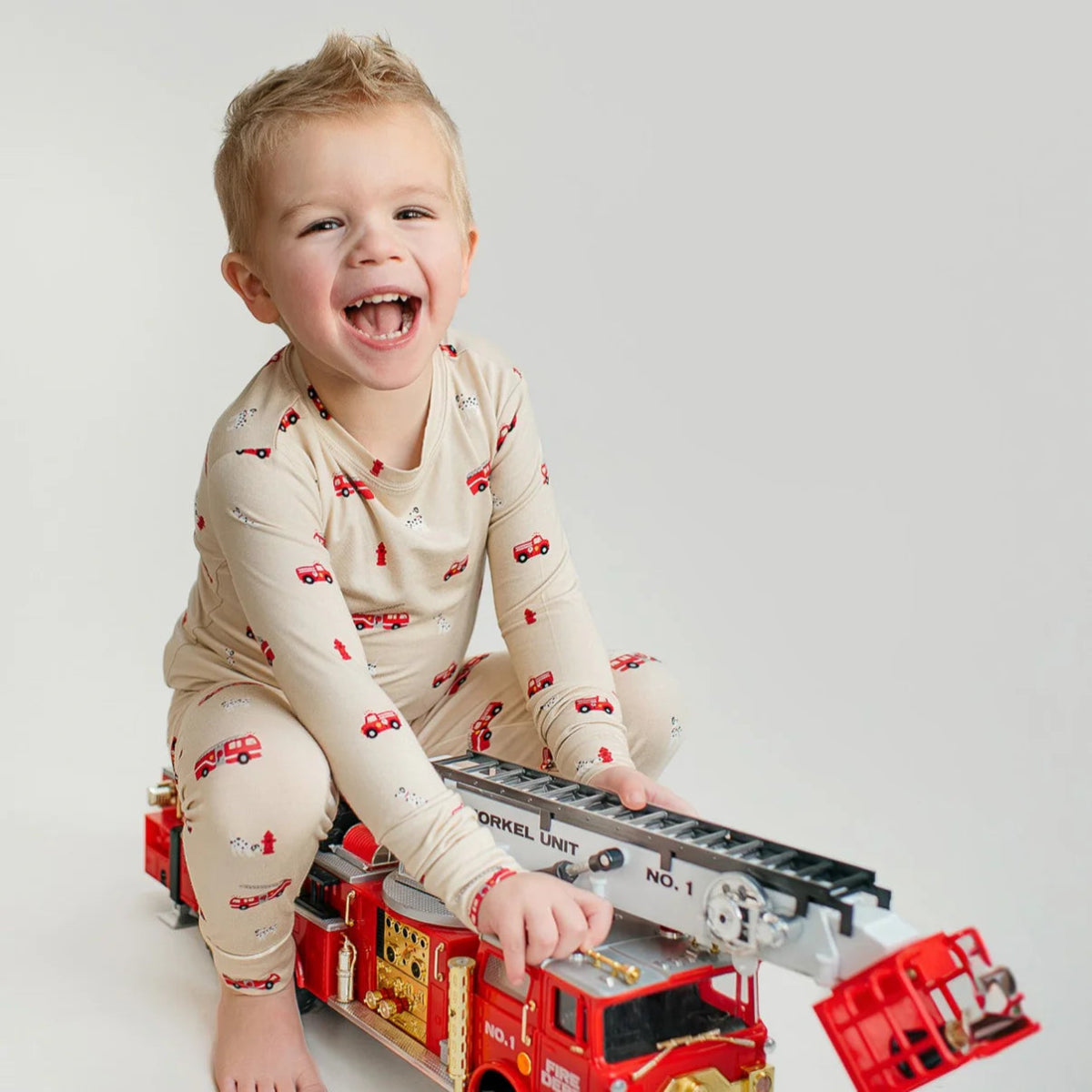 Firetruck Two - piece Pajama Set - Brave Little Ones Baby & Toddler Clothing sold by Rosebud & Jo
